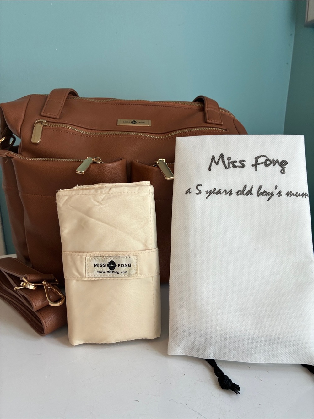 Miss Fong Women's Tan Baby convertible Bag, Cream Changing pad,Dust Bag, strap